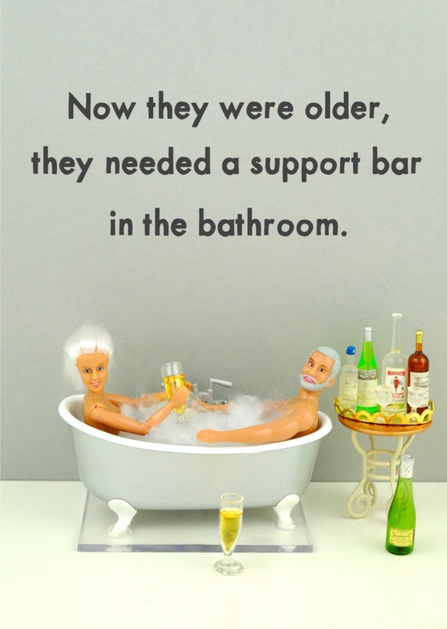 Bold And Bright Funny Photograph Of A Female And Male Doll Enjoying A Drink In A Bath Just To Say Ca