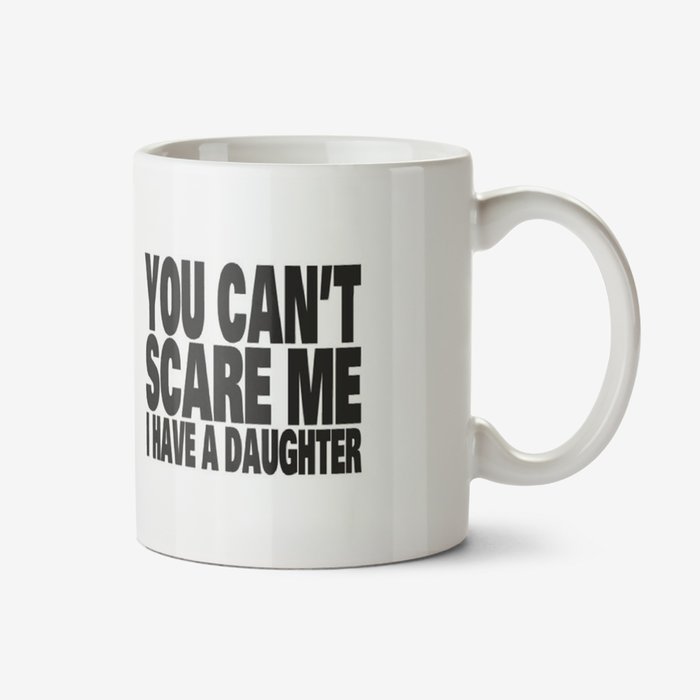 White typographic mug with a caption that reads You Can't Scare Me I Have A Daughter