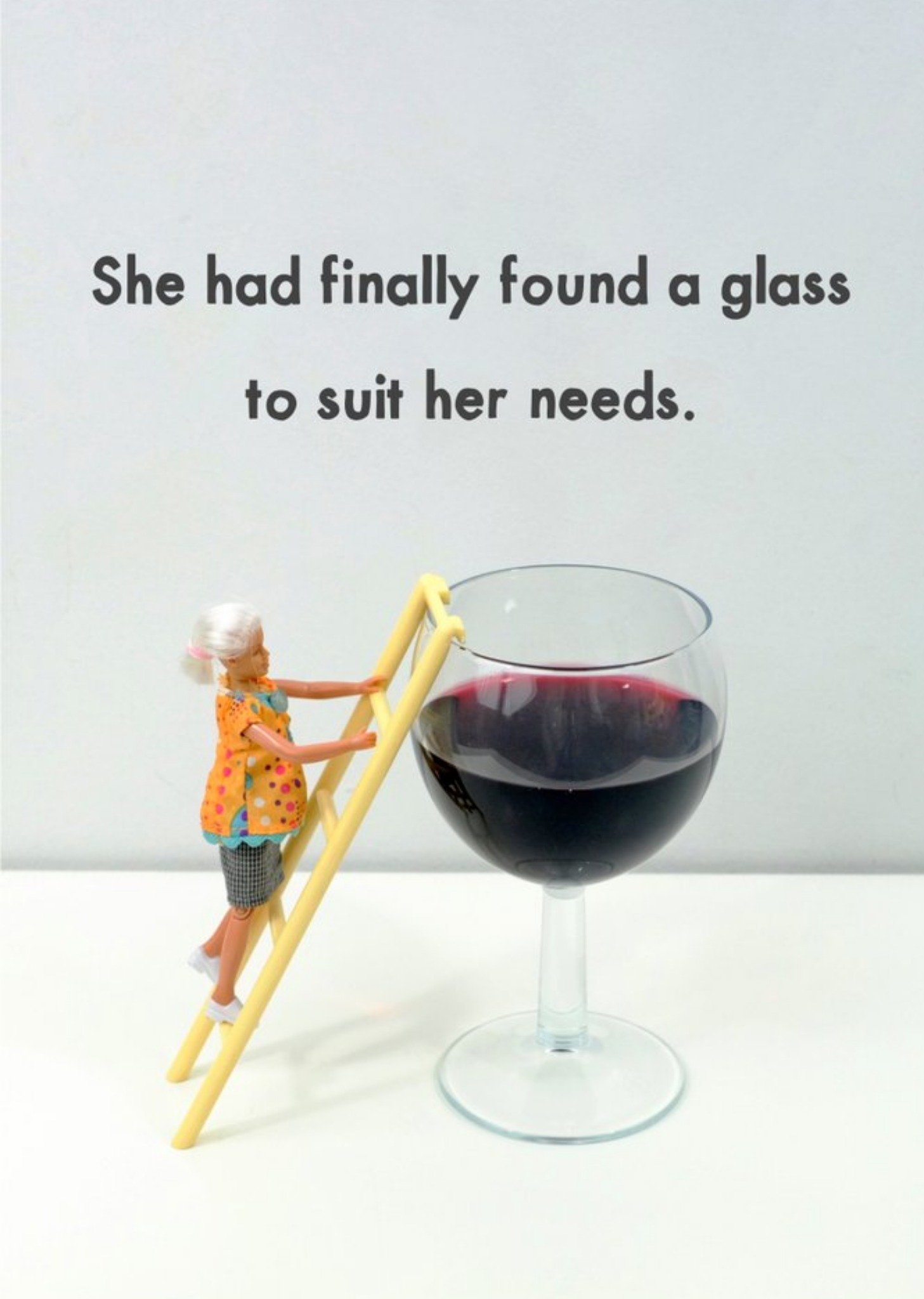 Bold And Bright Funny Photograph Of A Female Doll Climbing Into A Glass Of Red Wine Birthday Card