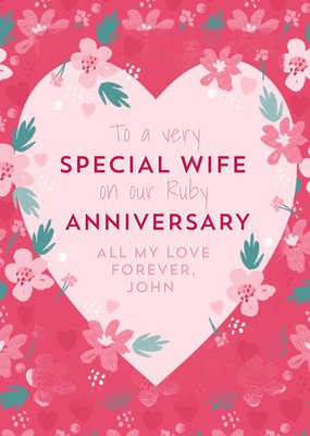 Heart Shaped Frame Surrounded By Flowers On A Pink Background Anniversary Card 