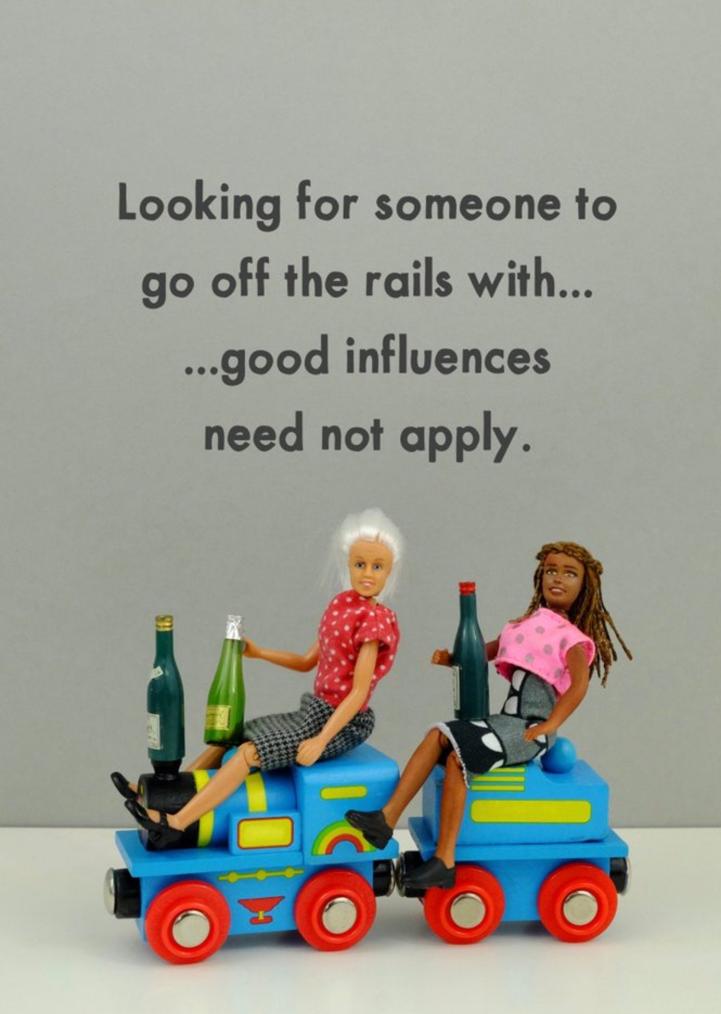 Bold And Bright Funny Photographic Image Of Two Dolls Riding A Toy Train Whilst Getting Drunk The Rails Card Ecard