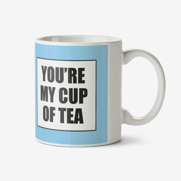 Blue typographic mug with two white boxes that have the caption You're My Cup Of Tea in them